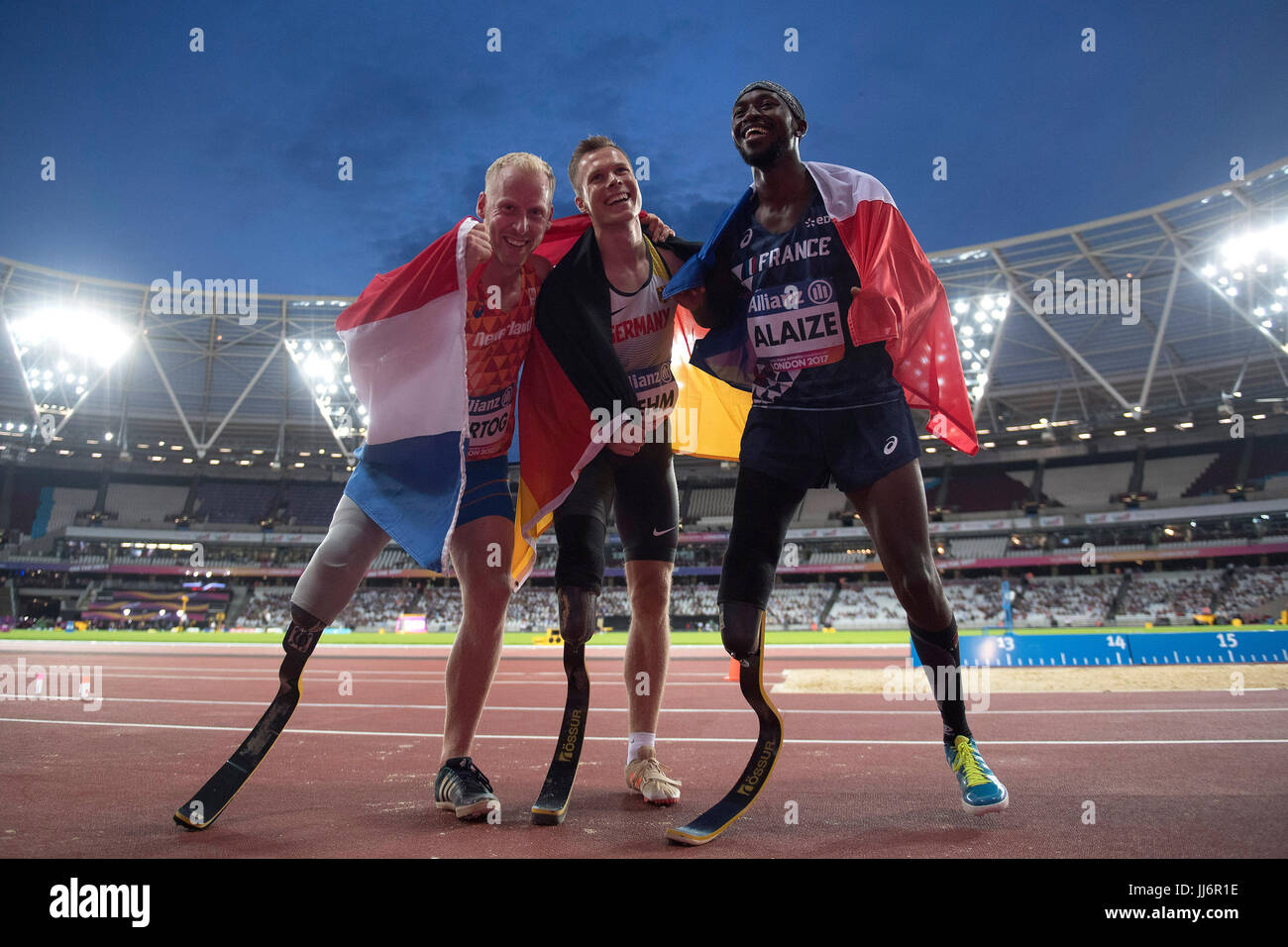 Netherland's Ronald Hertog, Germany's Markus Rehm, and France's Jean-Baptiste  Alaize celebrate their silver, gold and bronze positions following the  Men's Long Jump T44 final during day four of the 2017 World Para