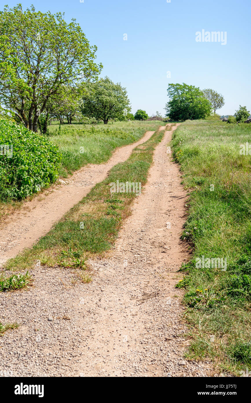 Bumpy country road in open landscape. Stock Photo