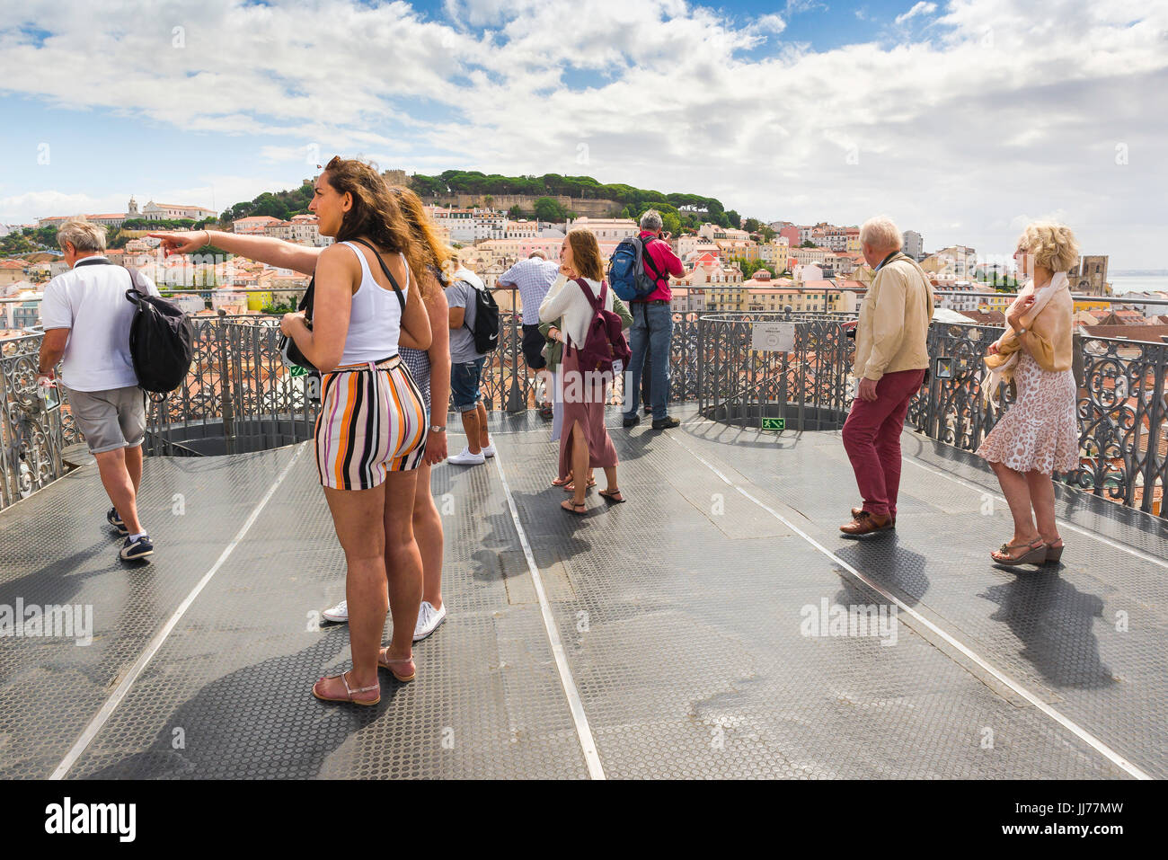 Lisbon tourists, visitors to the Elevador Santa Justa in the centre of Lisbon look out from the observation platform on to the city below, Portugal. Stock Photo