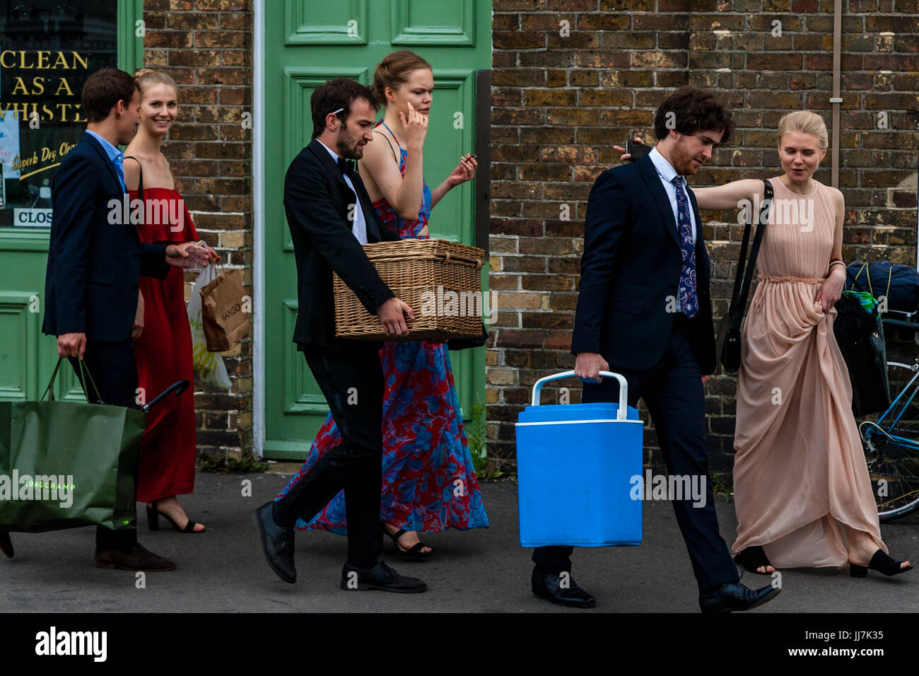 Young opera fans with their picnic baskets arrive at Lewes railway station en route to