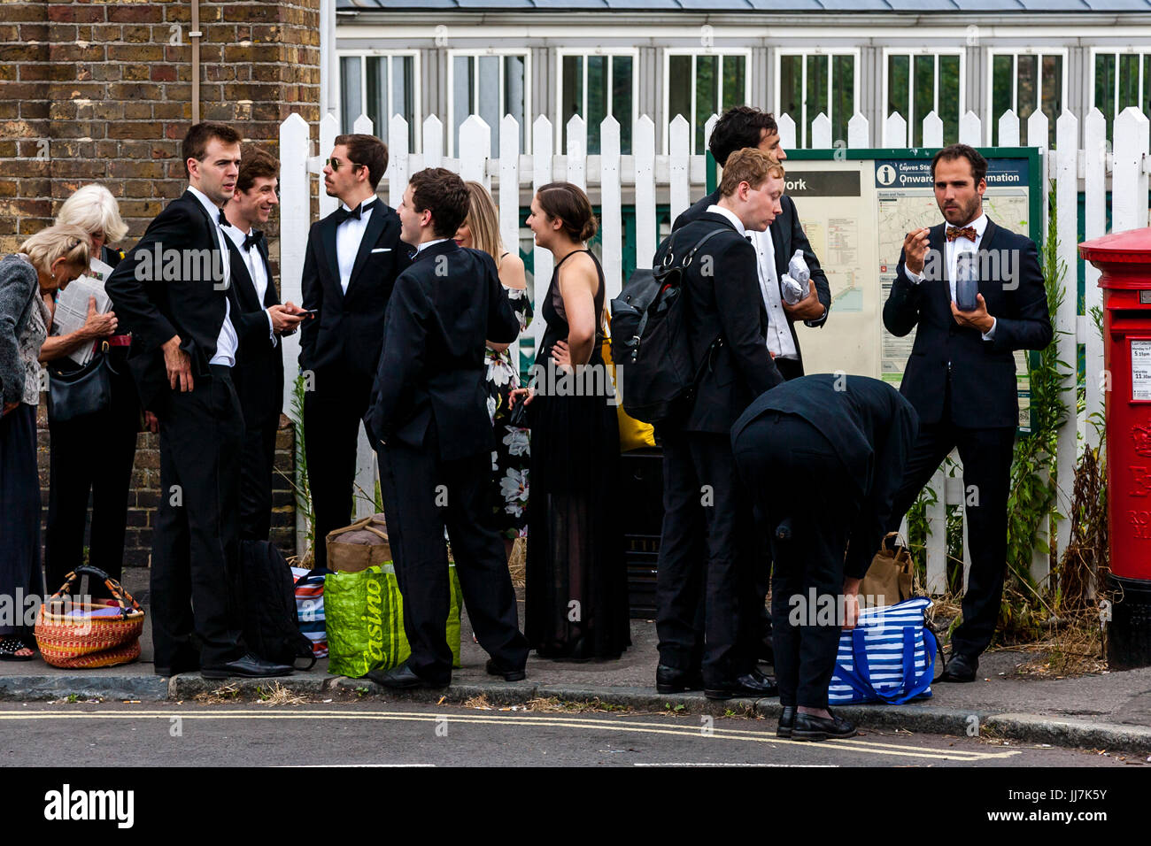 Young opera fans with their picnic baskets arrive at Lewes railway station en route to