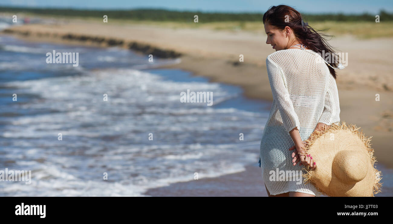 Beach travel - woman walking Stock Photo