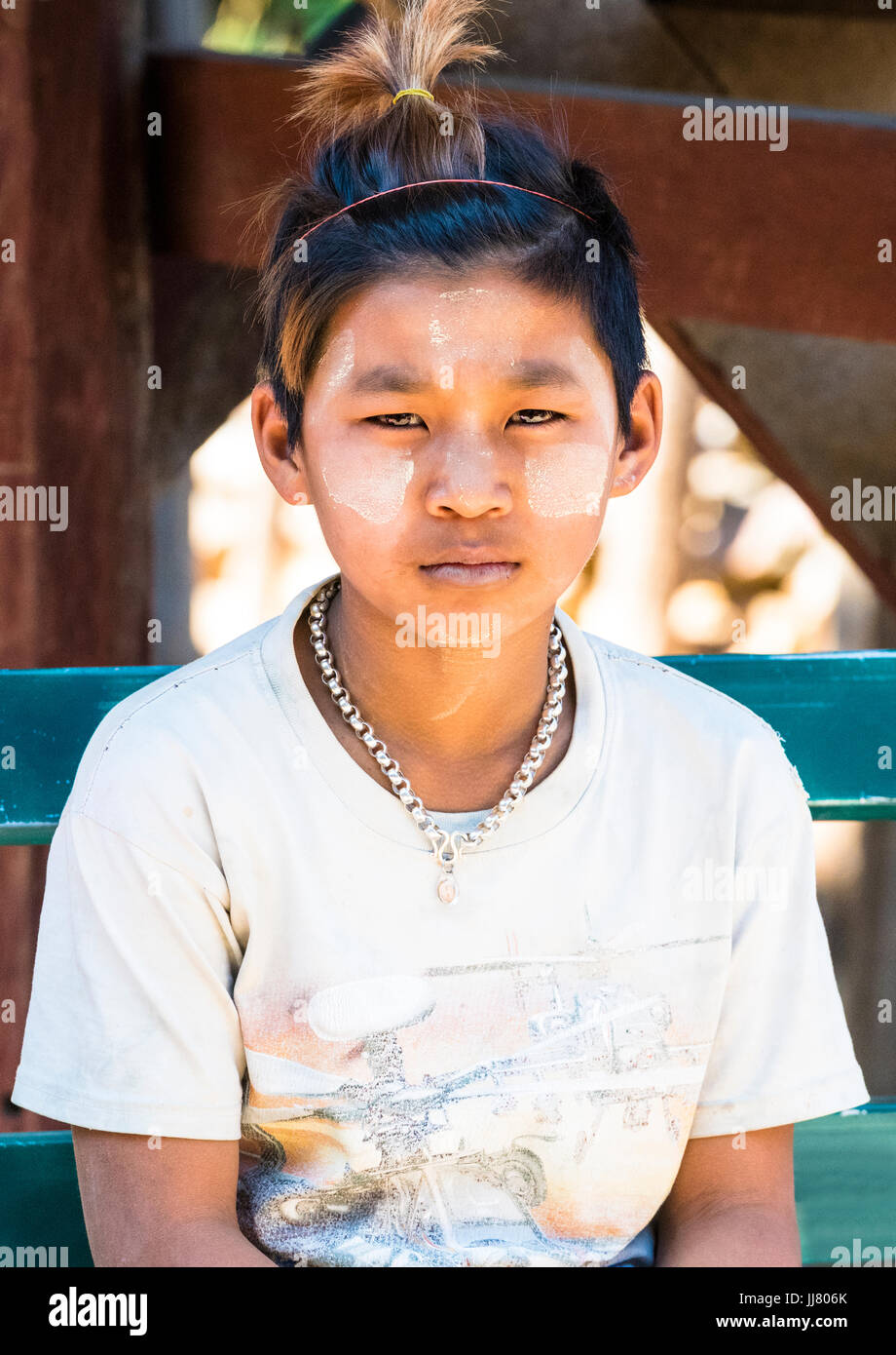 Portrait of a young Burmese woman with the traditional face paint or
