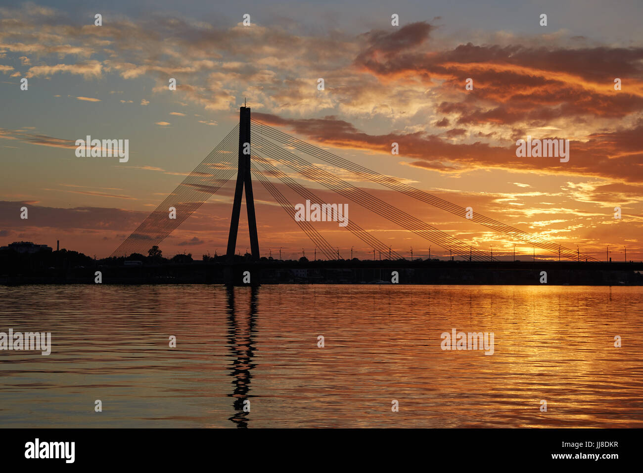 Silhouette of a cable-stayed bridge in Riga against a beautiful sunset ...