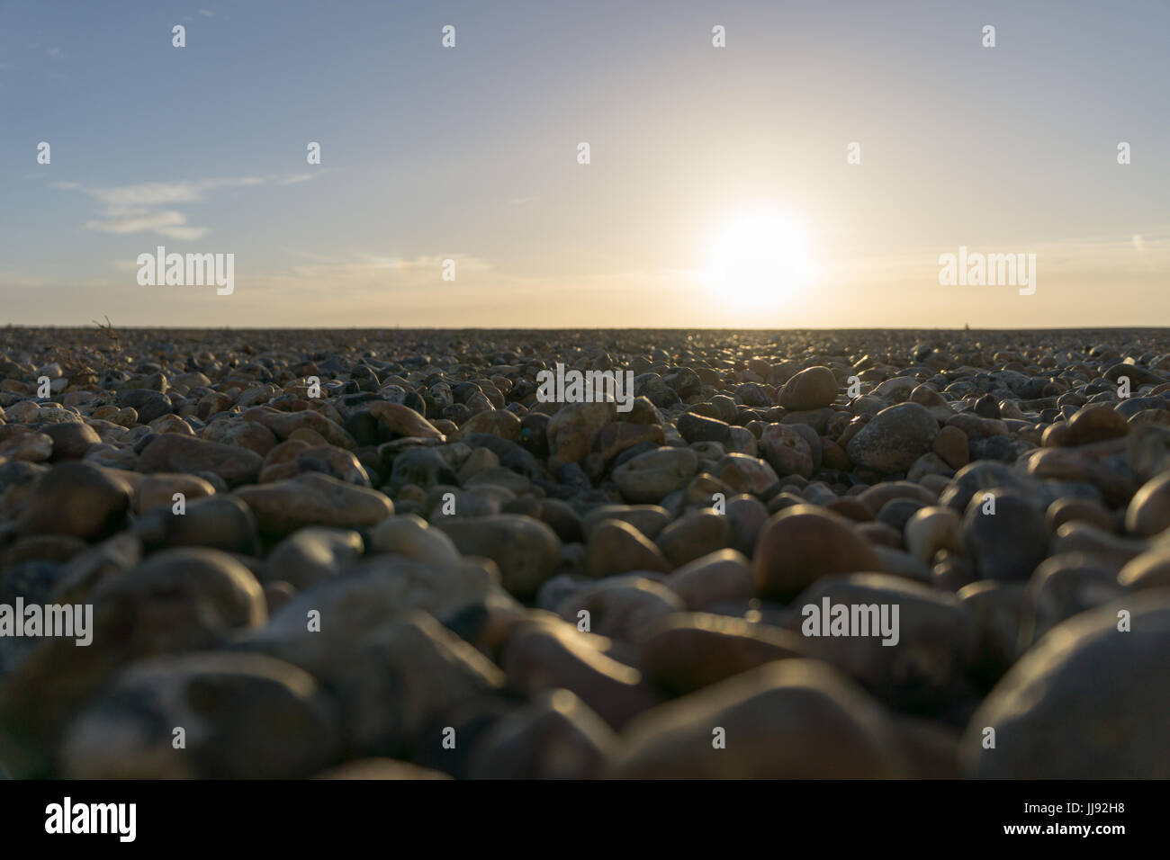 Pebbles on worthing beach, Beach, Shore at sunset. Stock Photo