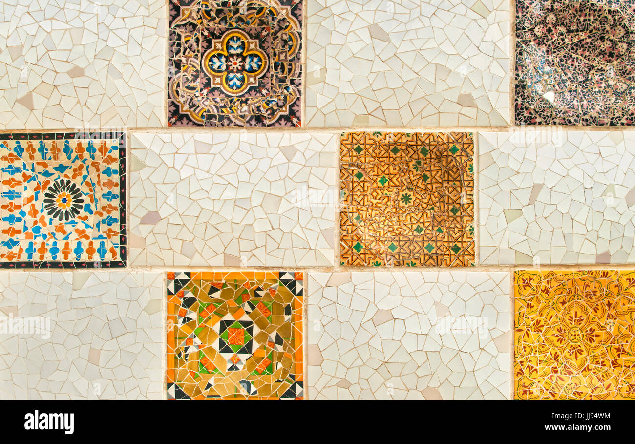 background image of colourful mosaic wall with square elements in Park Guell, Barcelona, Spain Stock Photo