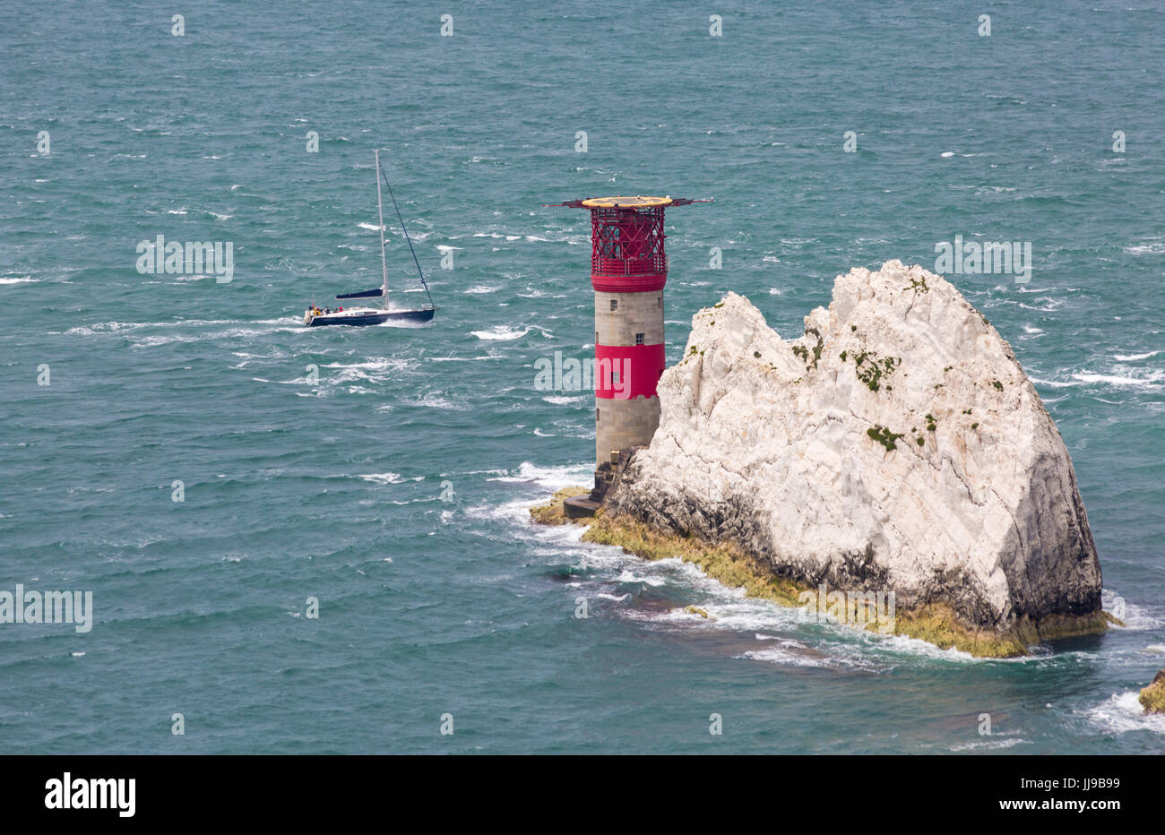 Yacht going around the Needles at the Isle of Wight, Hampshire, England ...