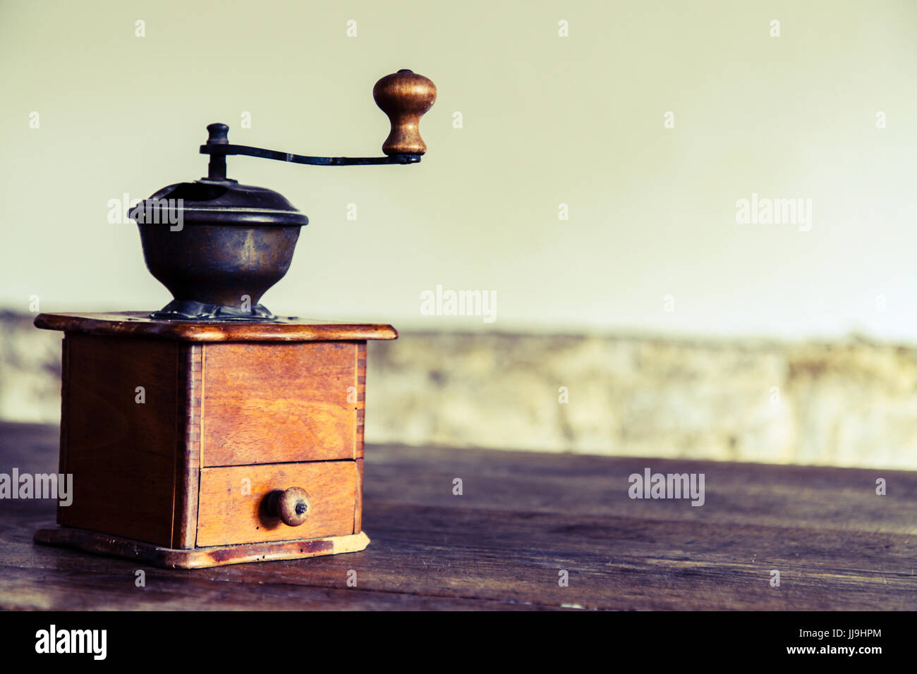 Vintage manual coffee grinder on the old wooden table Stock Photo Alamy