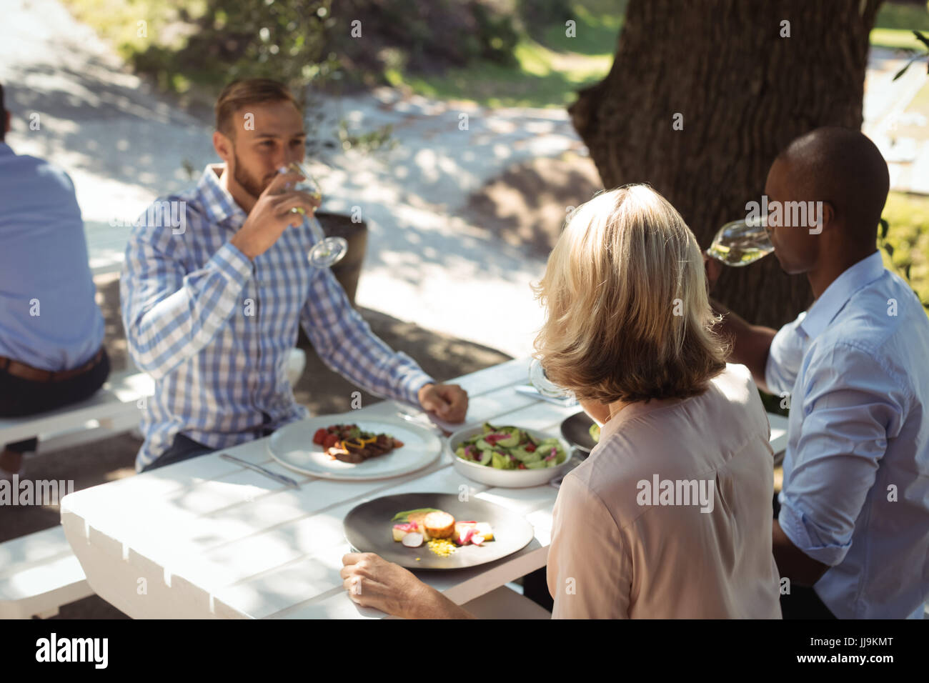 Group of friends having lunch in a restaurant Stock Photo