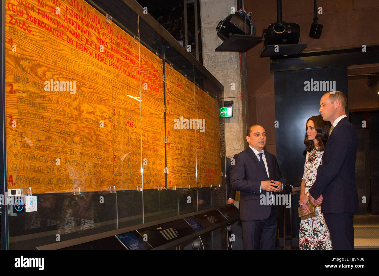 The Duke and Duchess of Cambridge view the striking shipyard workers list of 21 demands during a visit to the European Solidarity Movement museum, the birthplace of Poland's Solidarity movement that helped topple Communist rule. Stock Photo