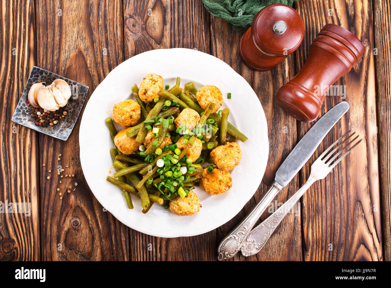 meatballs with green beans on the plate Stock Photo Alamy