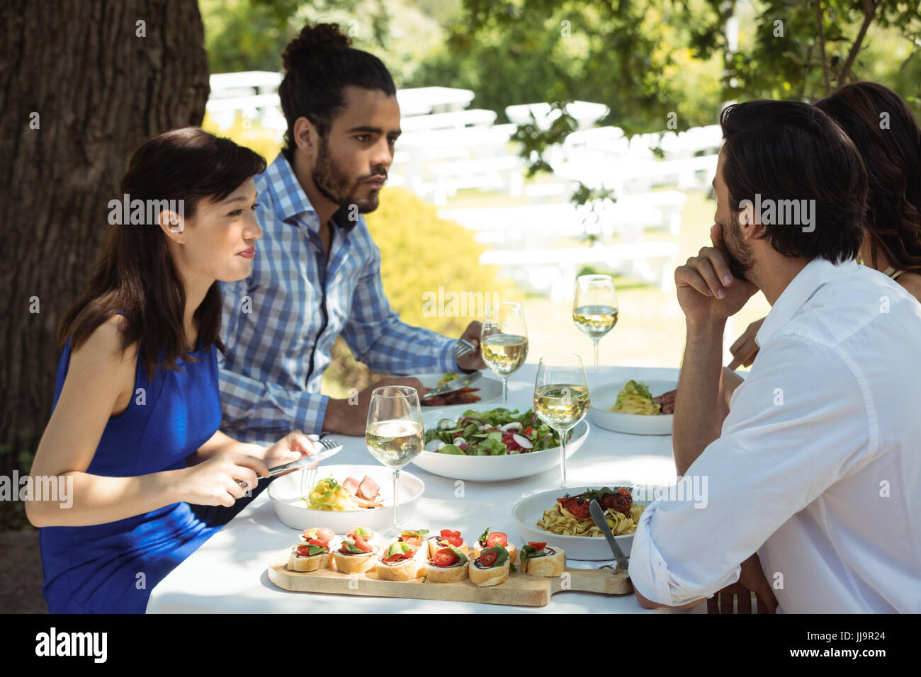 Group of friends having lunch in a restaurant Stock Photo