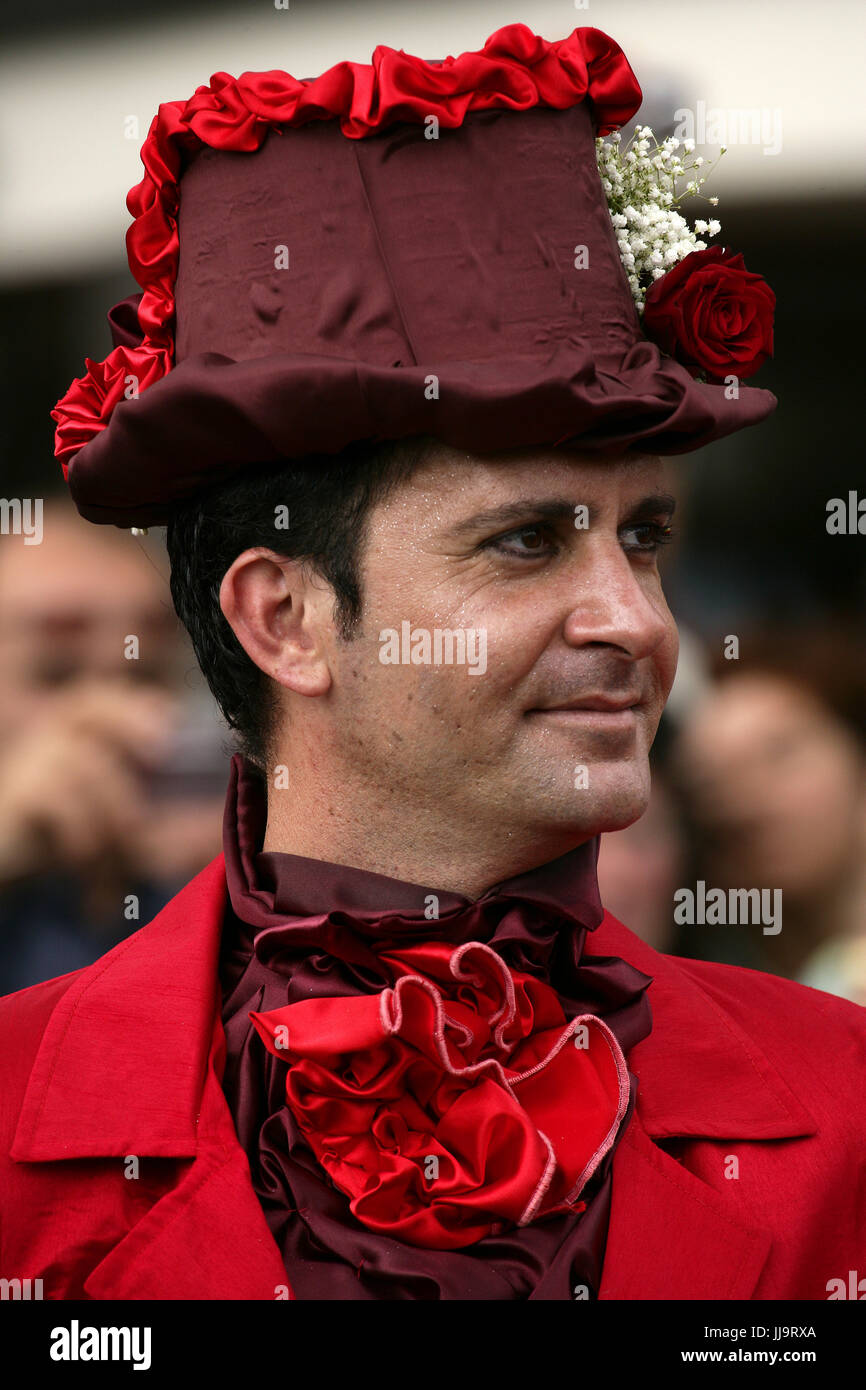 A man in a flowery hat at the Madeira Flower Festival Parade, Funchal, Madeira, Portugal Stock Photo