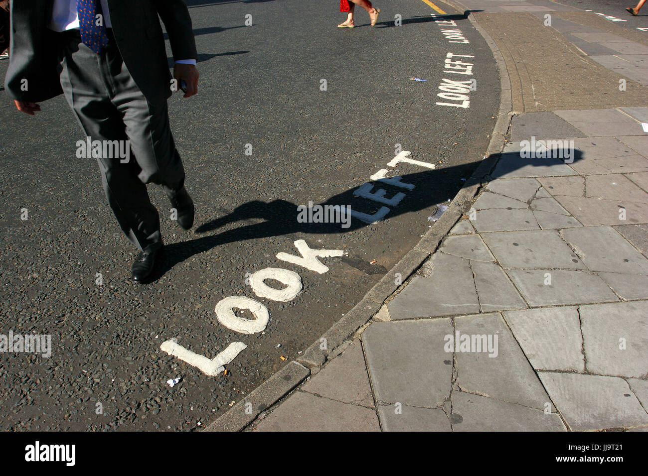 Words Look Left on the street warn pedestrians who may not be familiar