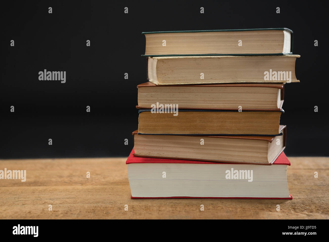 Close-up of book stack on table Stock Photo - Alamy