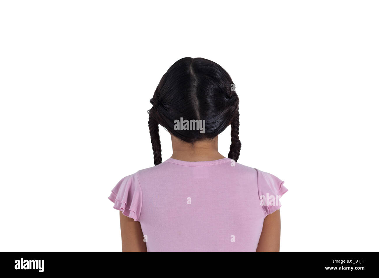 Rear view of girl standing against white background Stock Photo