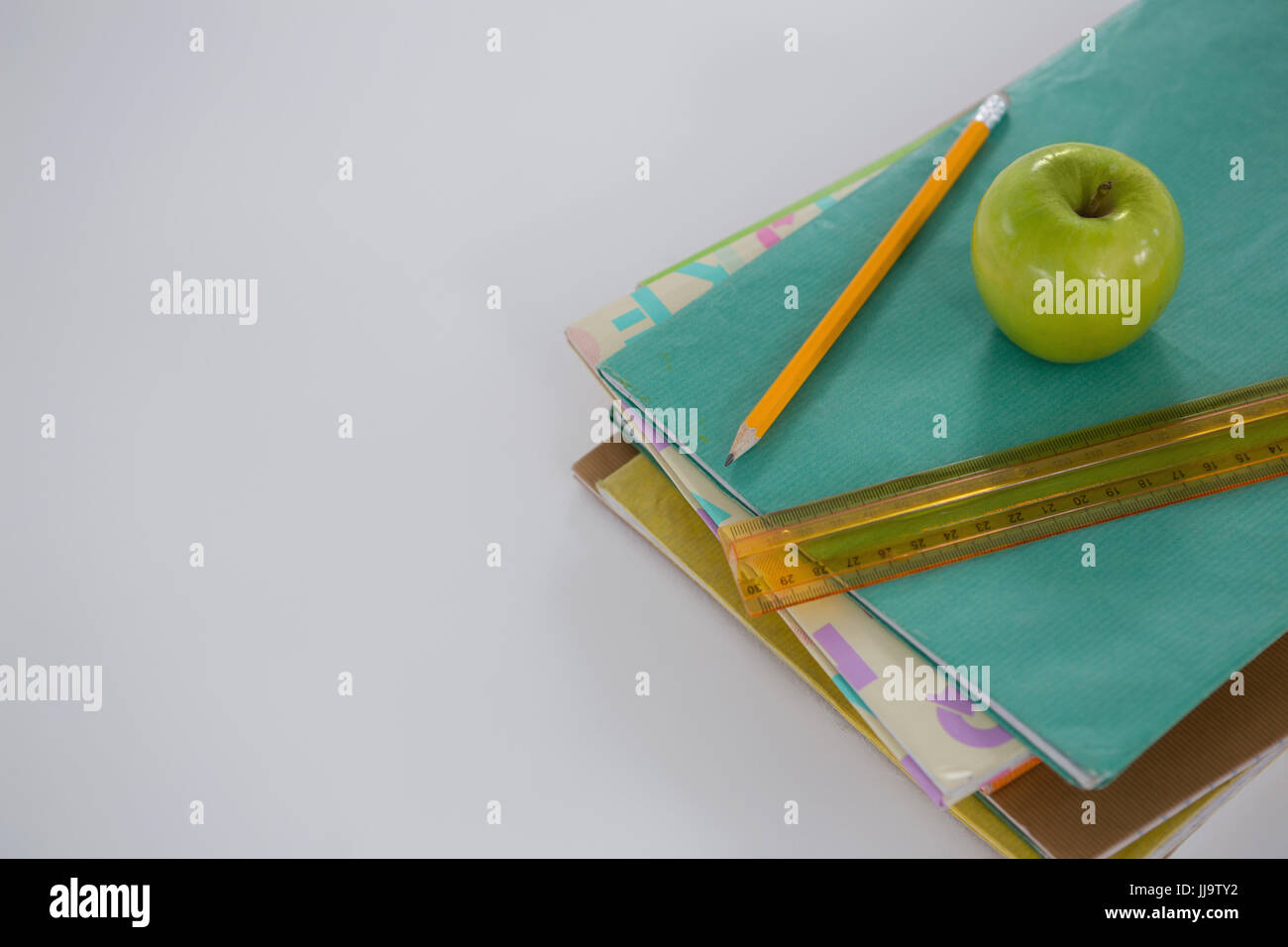 Book Stack With Ruler Apple Scale pencil hi-res stock photography and images - Alamy