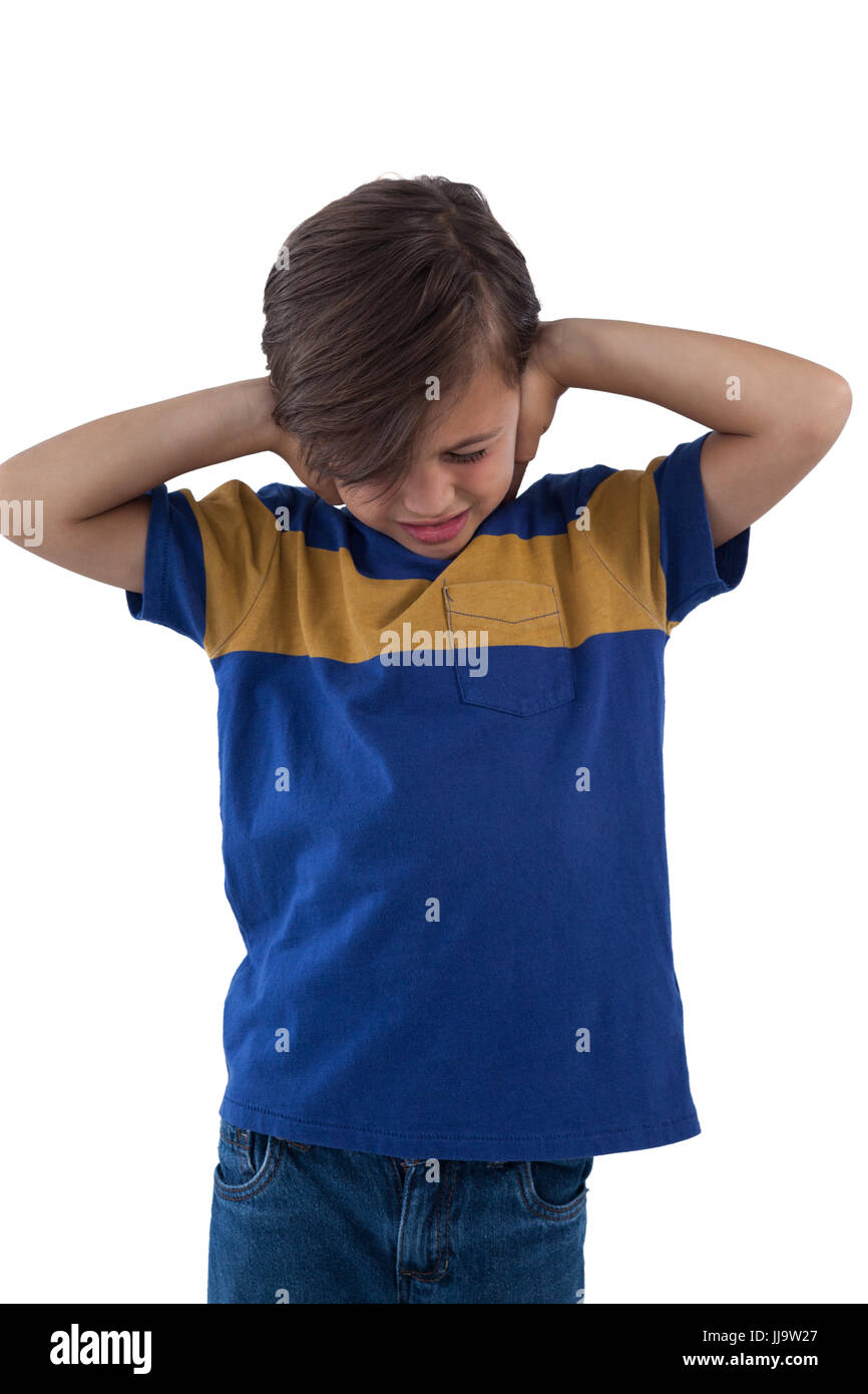 Frustrated boy covering his ears Stock Photo Alamy