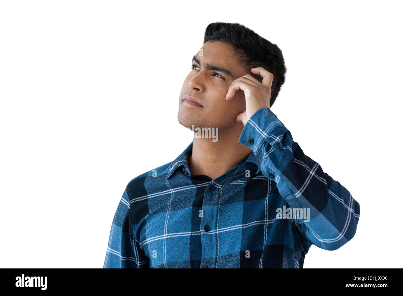 Close up of confused man against white background Stock Photo - Alamy