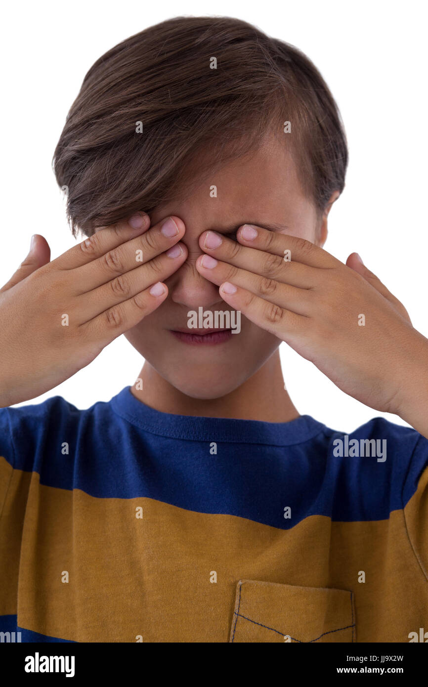 Cute boy covering his eyes Stock Photo - Alamy