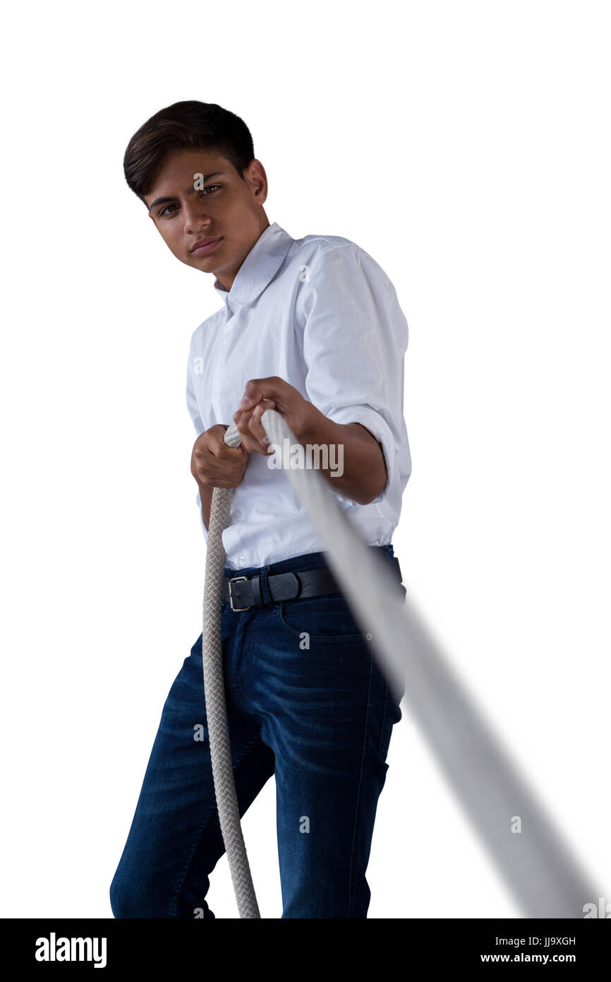 Boy pulling the rope against white background Stock Photo - Alamy