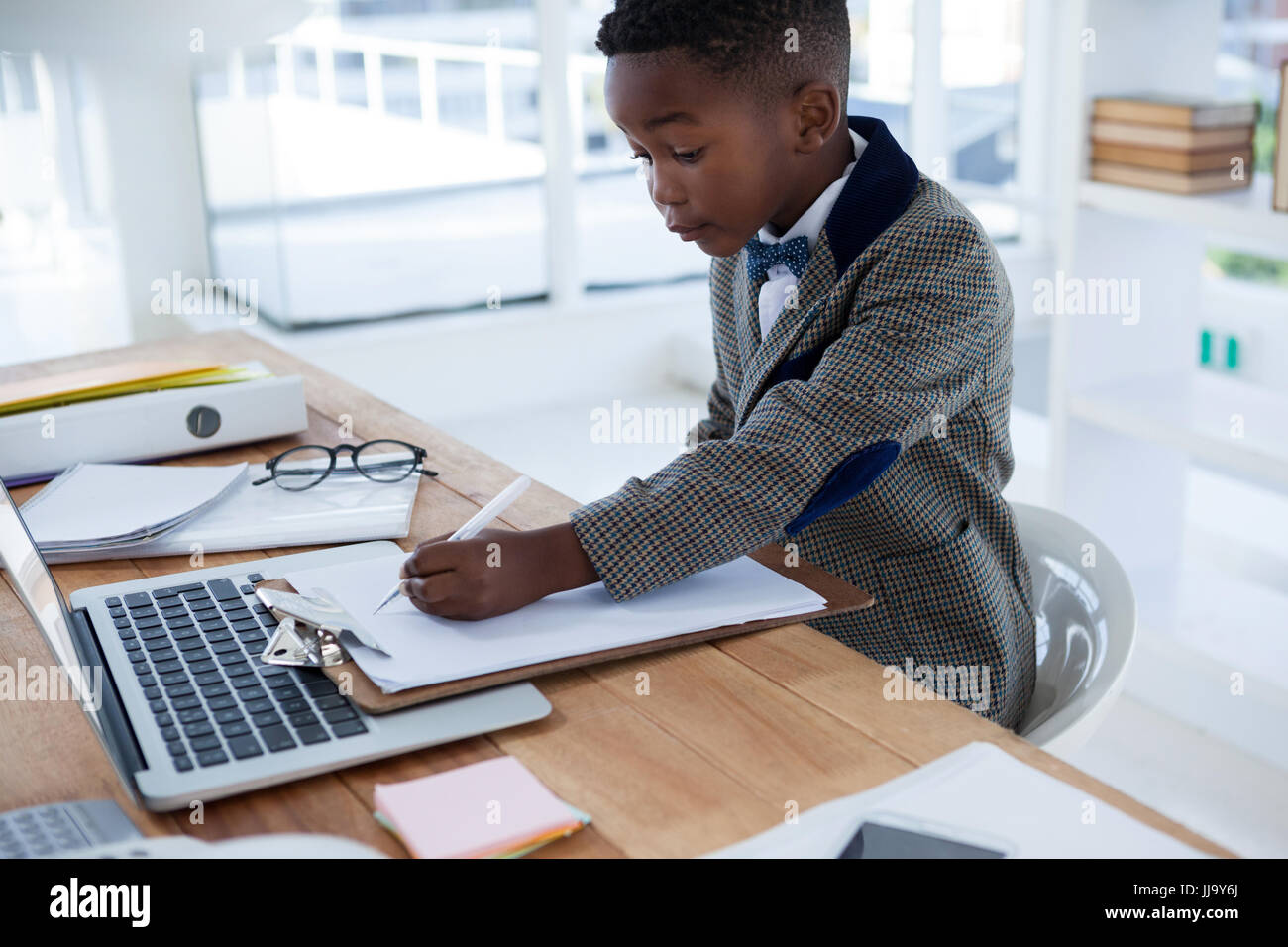 Businessman sitting desk making paper hi-res stock photography and ...