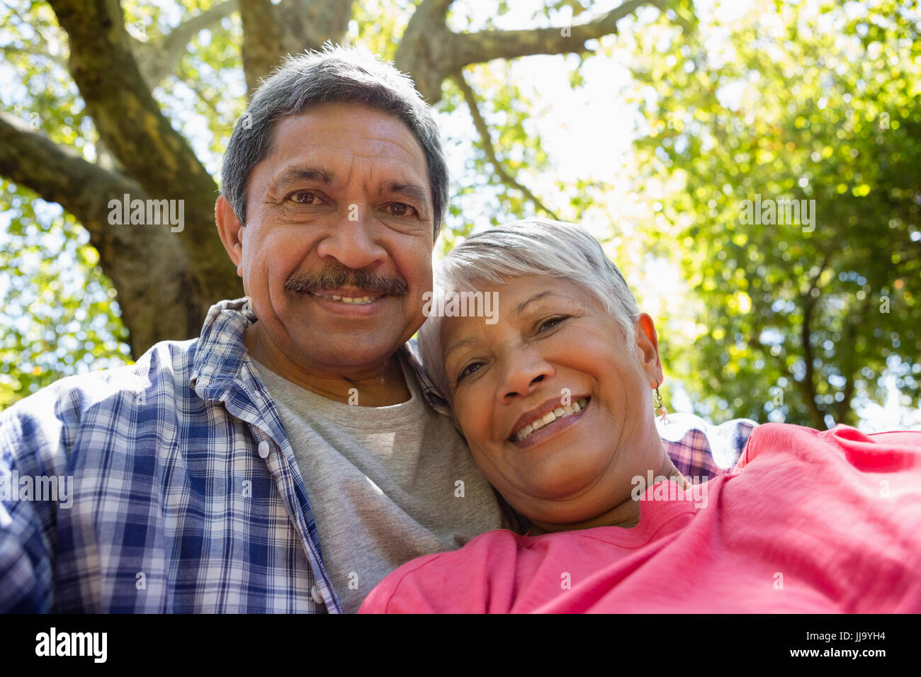 Senior couple taking a selfie at the park Stock Photo - Alamy