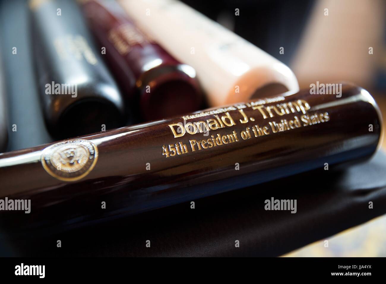 Washington, United States Of America. 18th July, 2017. A U.S made Marucci baseball bat engraved for President Donald Trump on display during a Made in America product showcase featuring items created in each of the 50 states in the Blue Room of the White House July 17, 2017 in Washington, DC. Credit: Planetpix/Alamy Live News Stock Photo