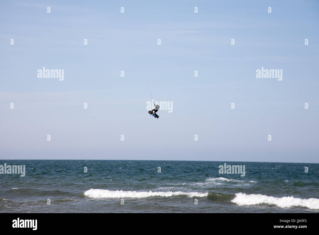 Brancaster, Norfolk, UK. 18th July 2017. UK Weather: Hot sunny spells on Norfolk coast. Kite surfers and birdlife on beach and marches Credit: WansfordPhoto/Alamy Live News Stock Photo