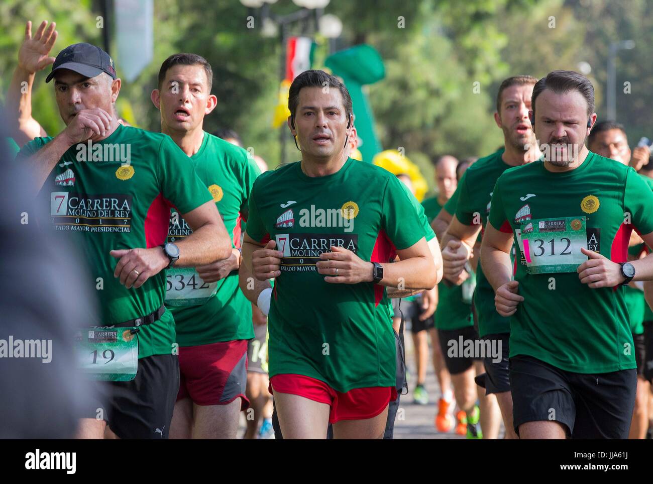 Mexico City, Mexico. 17th July, 2017. Mexican President Enrique Pena Nieto, center, takes part in the 7th Molino del Rey race in the forest of Chapultepec July 17, 2017 in Mexico City, Mexico. (presidenciamx via Planetpix) Stock Photo