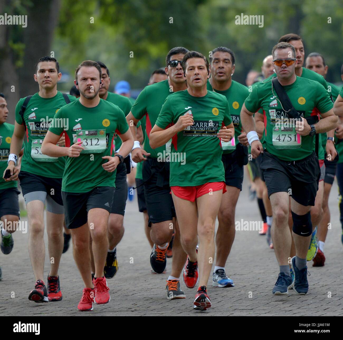 Mexico City, Mexico. 18th July, 2017. Mexican President Enrique Pena Nieto, center, takes part in the 7th Molino del Rey race in the forest of Chapultepec July 17, 2017 in Mexico City, Mexico. (presidenciamx via Planetpix) Stock Photo