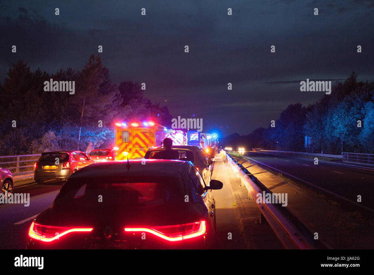 Flintshire, North, UK. 18th July, 2017. UK Weather. A serious road traffic accident this evening at Dobshill Interchange Emgergency Services at the Scene treating injured and Accident Investigation on Scene. Road clear of traffic by reversing off A55 into Dobshill down slip road. Credit: DGDImages/Alamy Live News Stock Photo