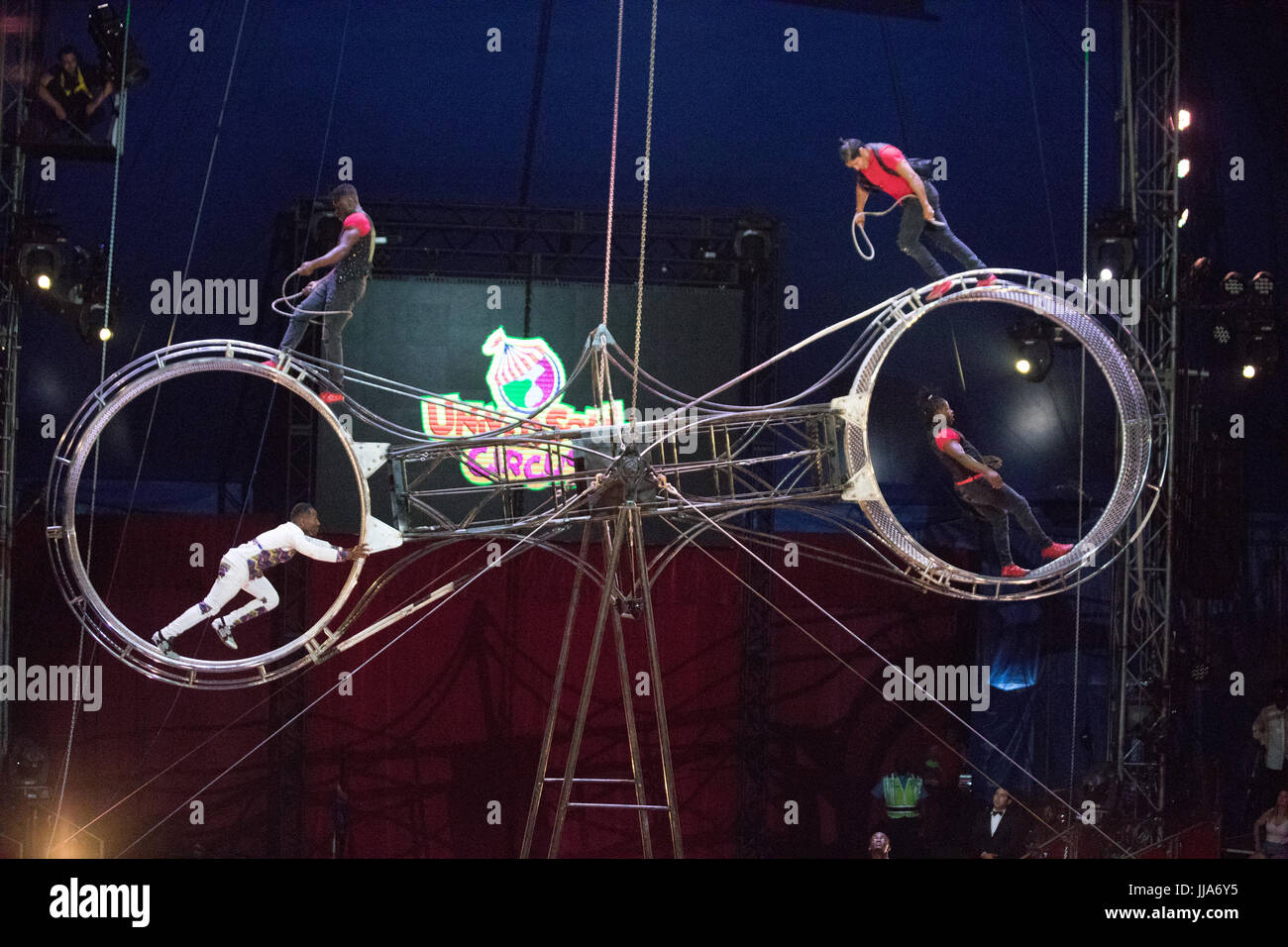 Acrobats perform on the "Wheel of Death" with the UniverSoul Circus