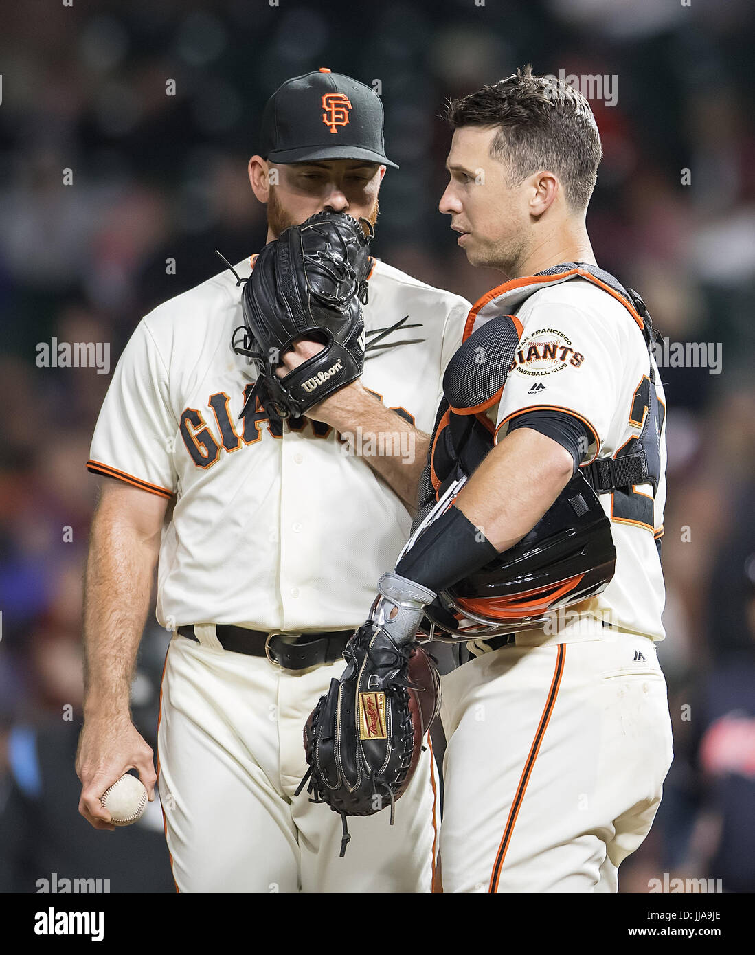 San Francisco, California, USA. 18th July, 2017. San Francisco Giants catcher Buster Posey (28) talks with San Francisco Giants relief pitcher Sam Dyson (49) after walking the first batter in the ninth inning, during a MLB baseball game between the Cleveland Indians and the San Francisco Giants at AT&T Park in San Francisco, California. Valerie Shoaps/CSM/Alamy Live News Stock Photo