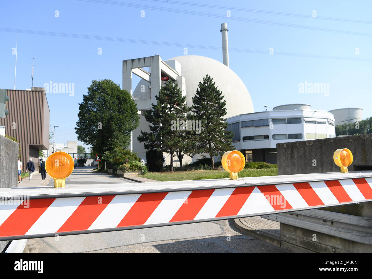 Biblis, Germany. 19th July, 2017. A gate for vehicles seen by the access road leading to to Unit A of the nuclear power plant in Biblis, Germany, 19 July 2017. The official dismantling of the decommissioned nuclear power plant has begun. Following the disaster in Fukushima, Japan, the facility was first shut down for an initial period of three months in 2011 and subsequently closed permanently. Photo: Arne Dedert/dpa/Alamy Live News Stock Photo