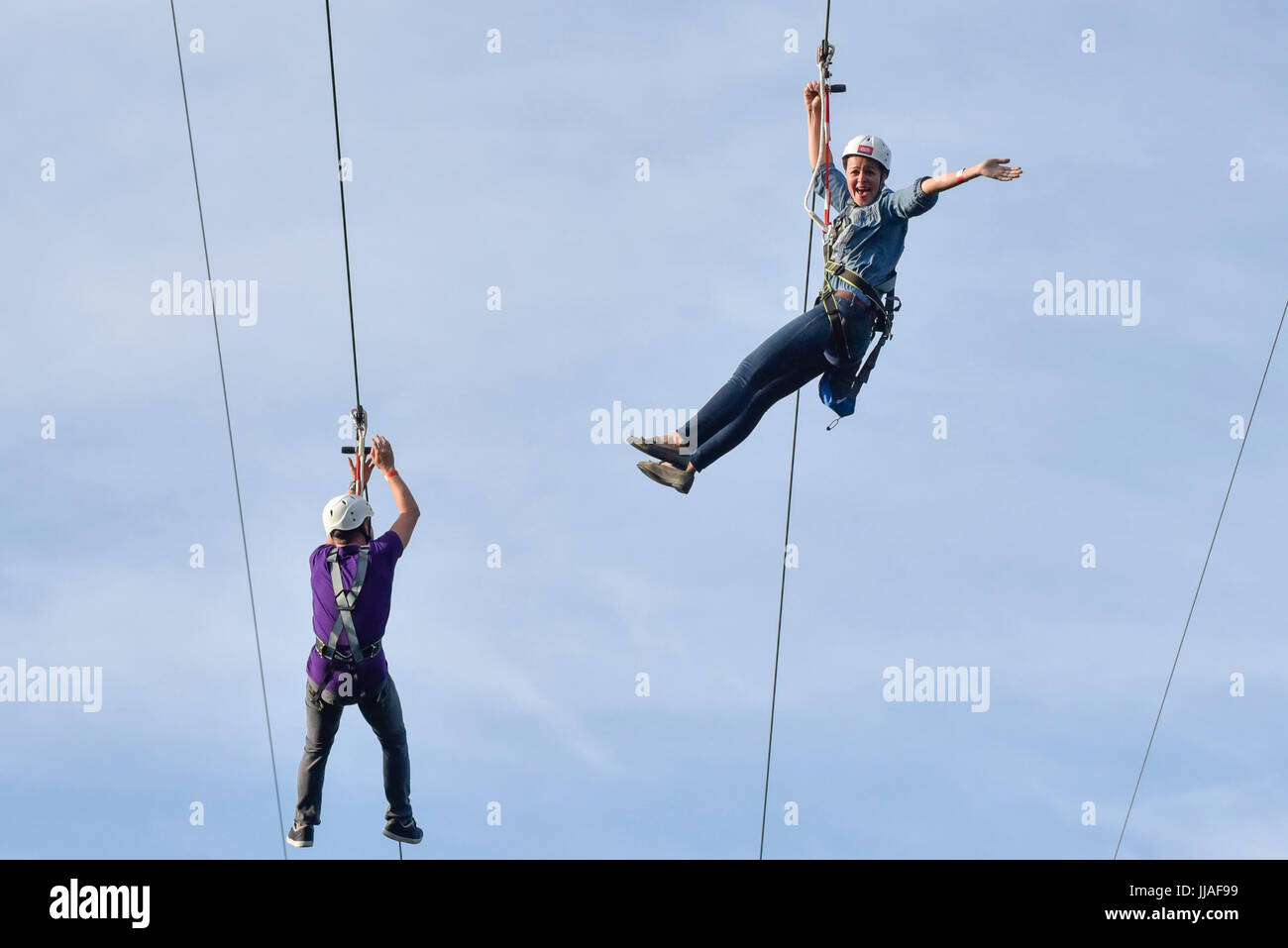 London, UK. 19th July, 2017. Brave participants ride a newly installed 225m long zip wire in Archbishop's Park on the South Bank. Descending from the top of a 35m tower, riders are afforded bird's eye view of the capital. Called Zip World London, the rides are offered to the public until 1 October 2017. Credit: Stephen Chung/Alamy Live News Stock Photo