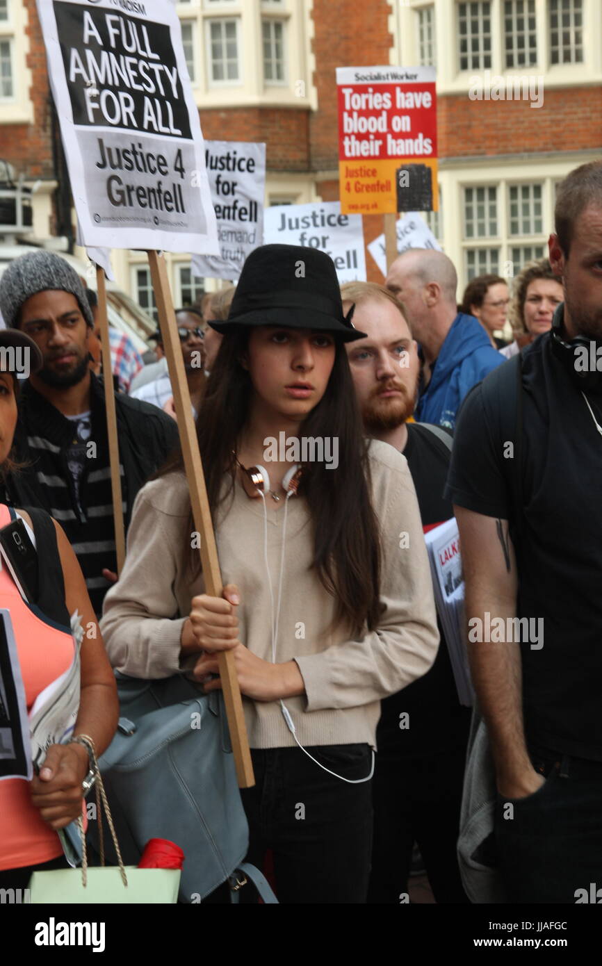 London, UK. 19th July 2017. Protesters listen to a rally outside the Kensington and Chelsea Council building as the council meets to  discuss the Grenfell disaster a month after it happened. Roland Ravenhill/Alamy Live News. Credit: Roland Ravenhill/Alamy Live News Stock Photo