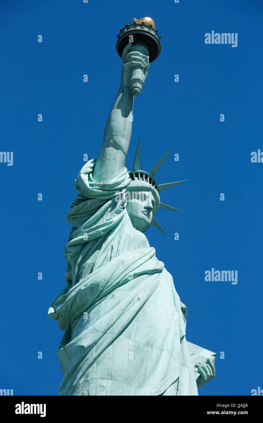 Statue of Liberty low angle view, blue sky in New York Stock Photo