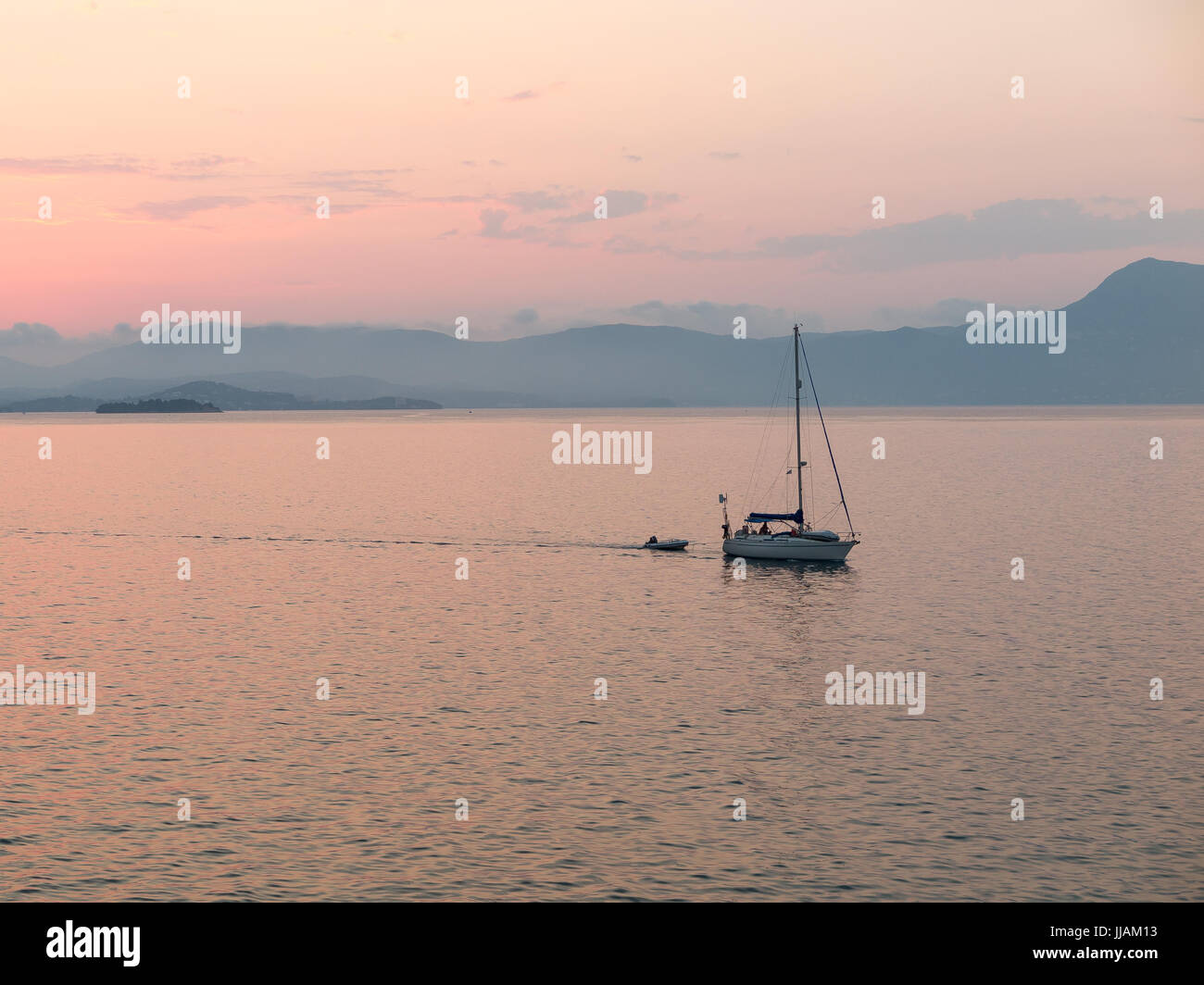 Sailing boat at sunset, Corfu, Greece Stock Photo
