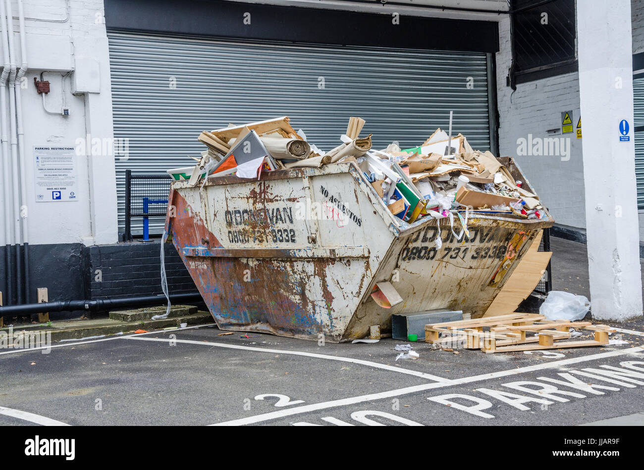 Skip rubbish full hires stock photography and images Alamy