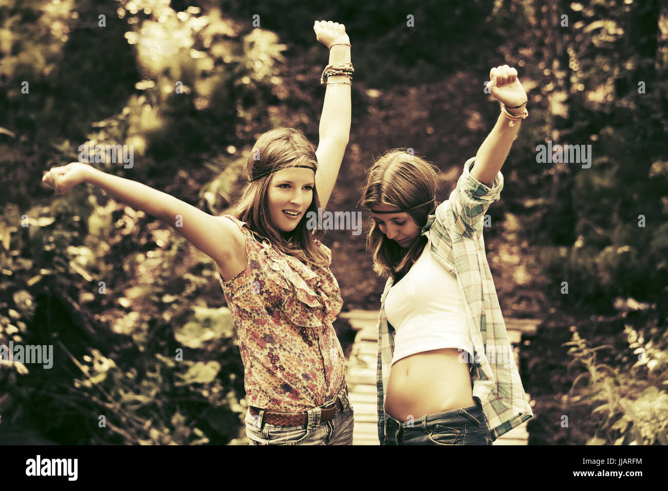 Two happy teen girls in a summer forest Stock Photo - Alamy