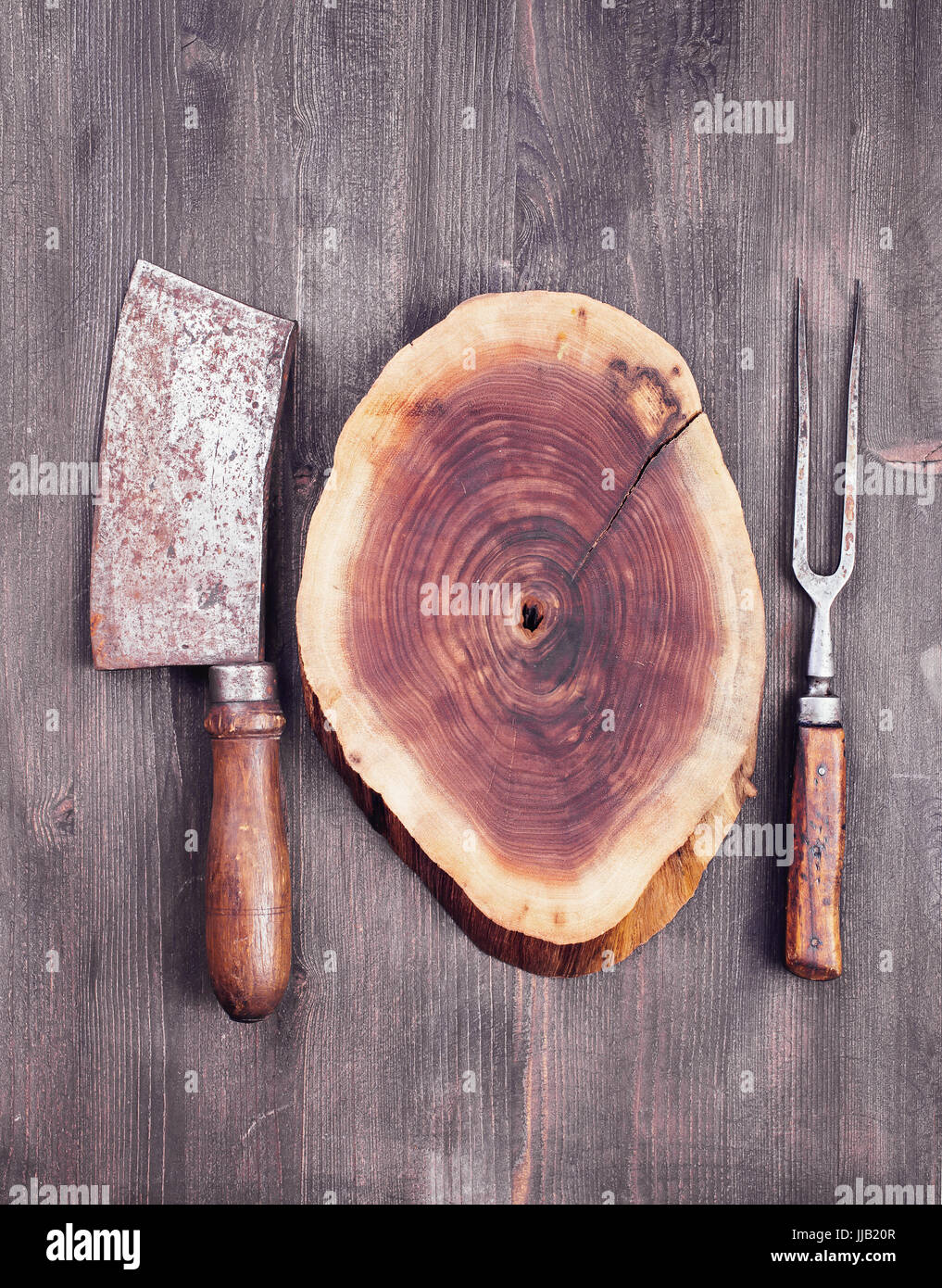 Wooden cut with cleaver knife and fork Stock Photo Alamy