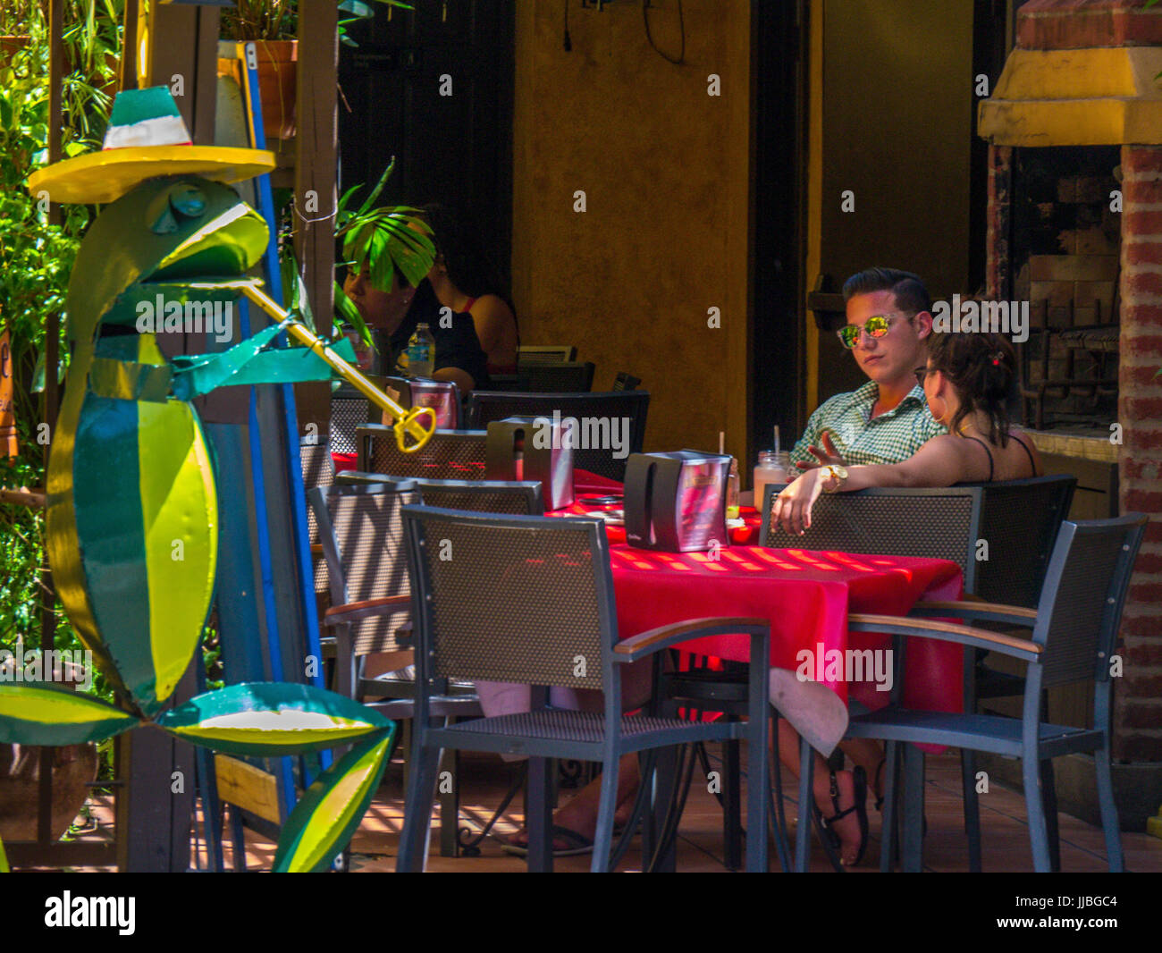 Couple in outdoor restaurant in Cuban neighborhood of Little Havana in Miami Florida Stock Photo