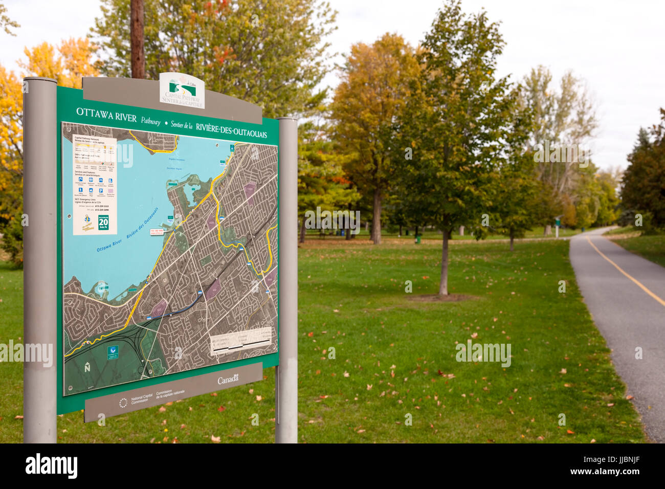 A sign and map for the Ottawa River Pathway or Capital Pathway which is also part of the Trans Canada Trail at Brittania Park in Ottawa, Ontario. Stock Photo