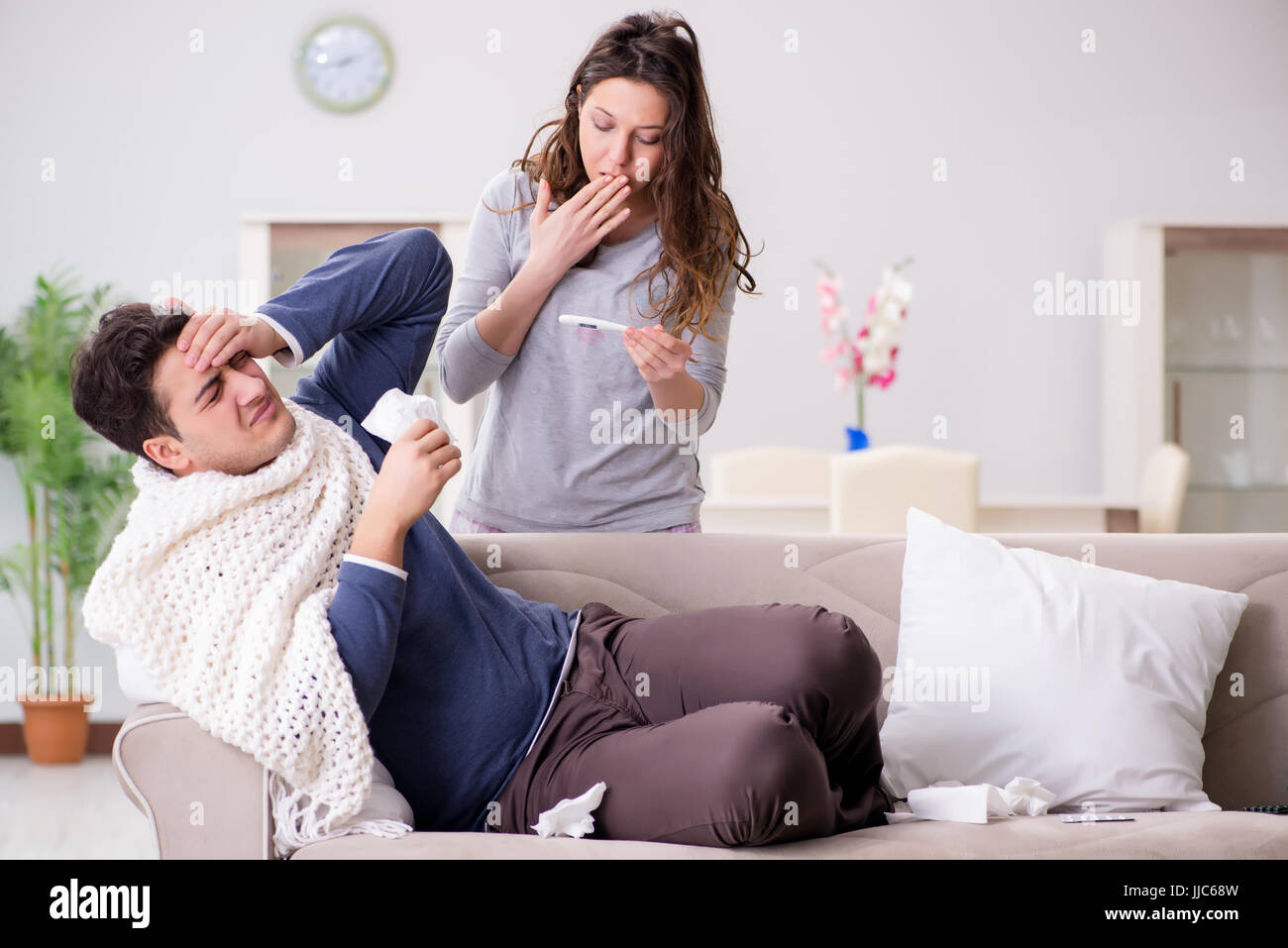 Wife caring for sick husband at home Stock Photo - Alamy