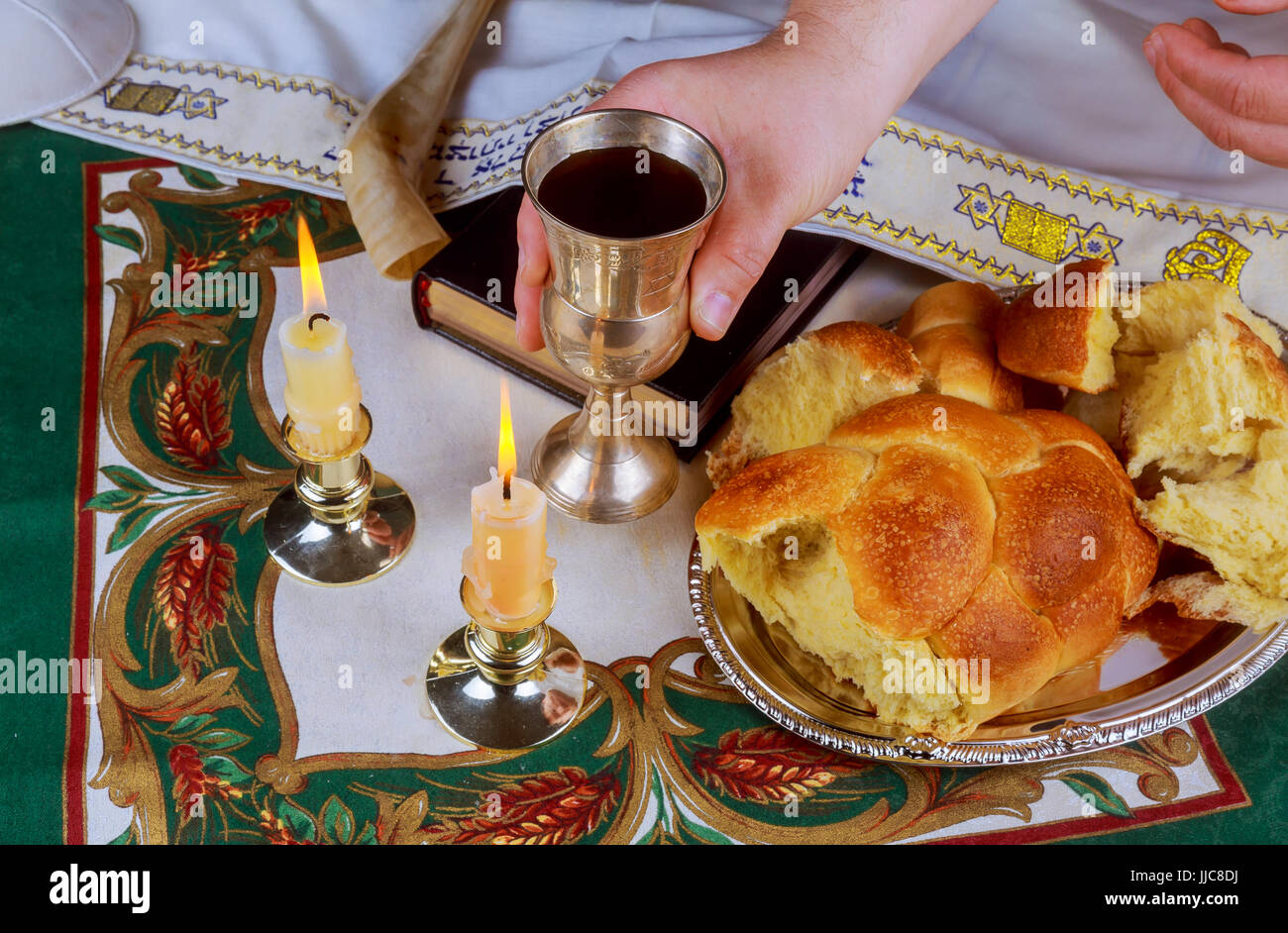 Shabbat eve table with uncovered challah bread, Sabbath candles Stock Photo Alamy