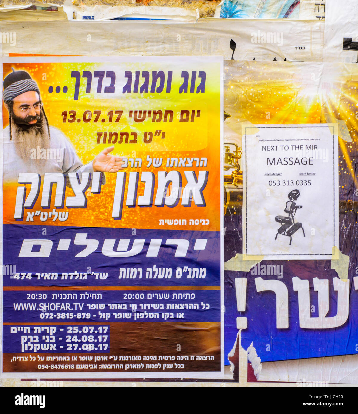 JERUSALEM, ISRAEL - JULY 12, 2017: Combination of posters about religious preaching, and massages, in the ultra-orthodox neighborhood Mea Shearim, Jer Stock Photo