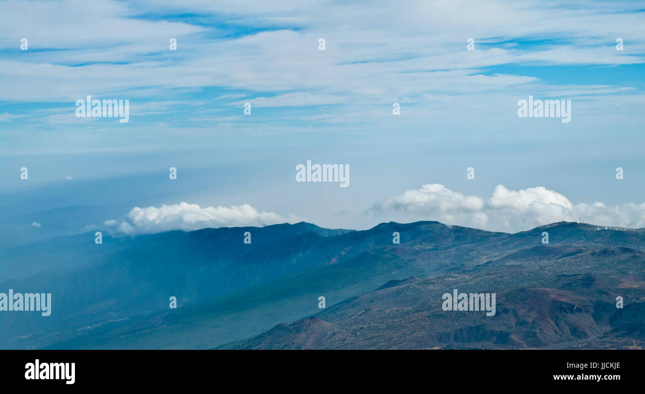 view of mountain range and clouds in el teide national park, tenerife