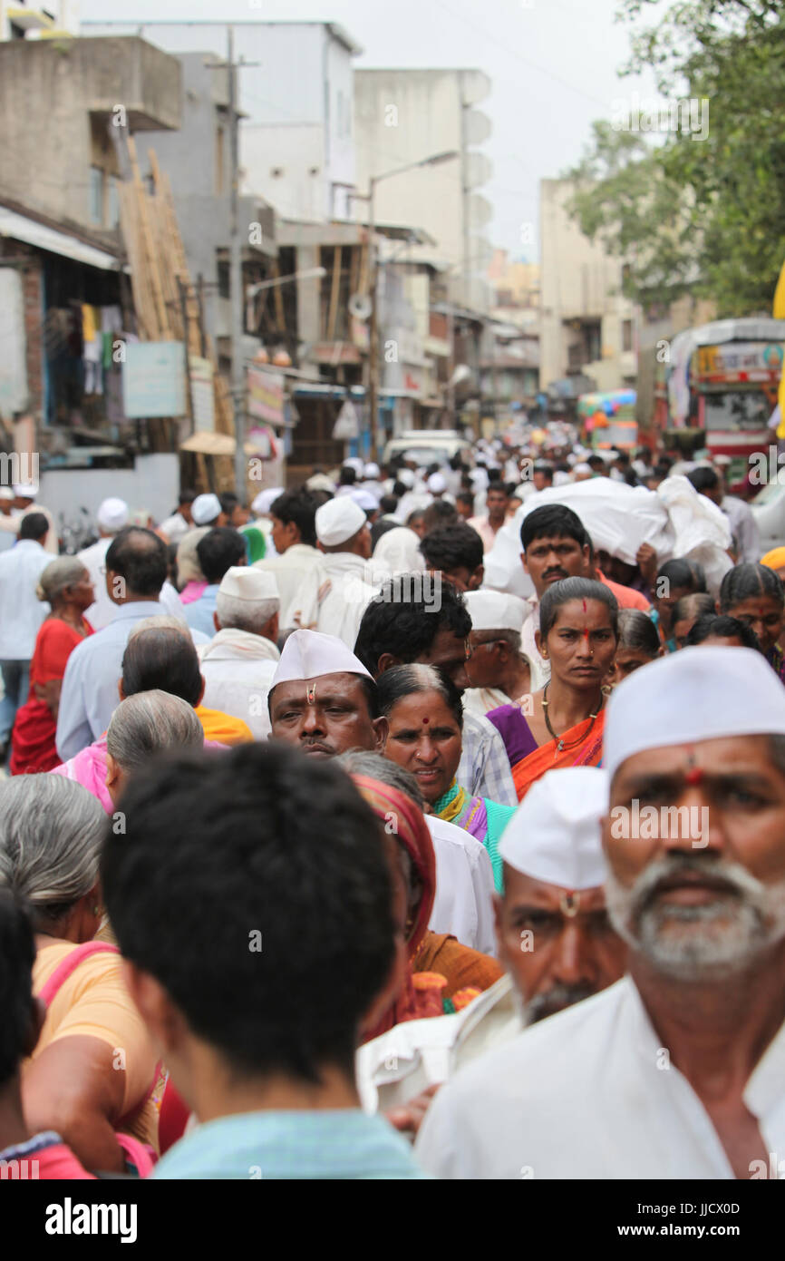 A crowded street in an Indian village during a hindu festival Stock Photo