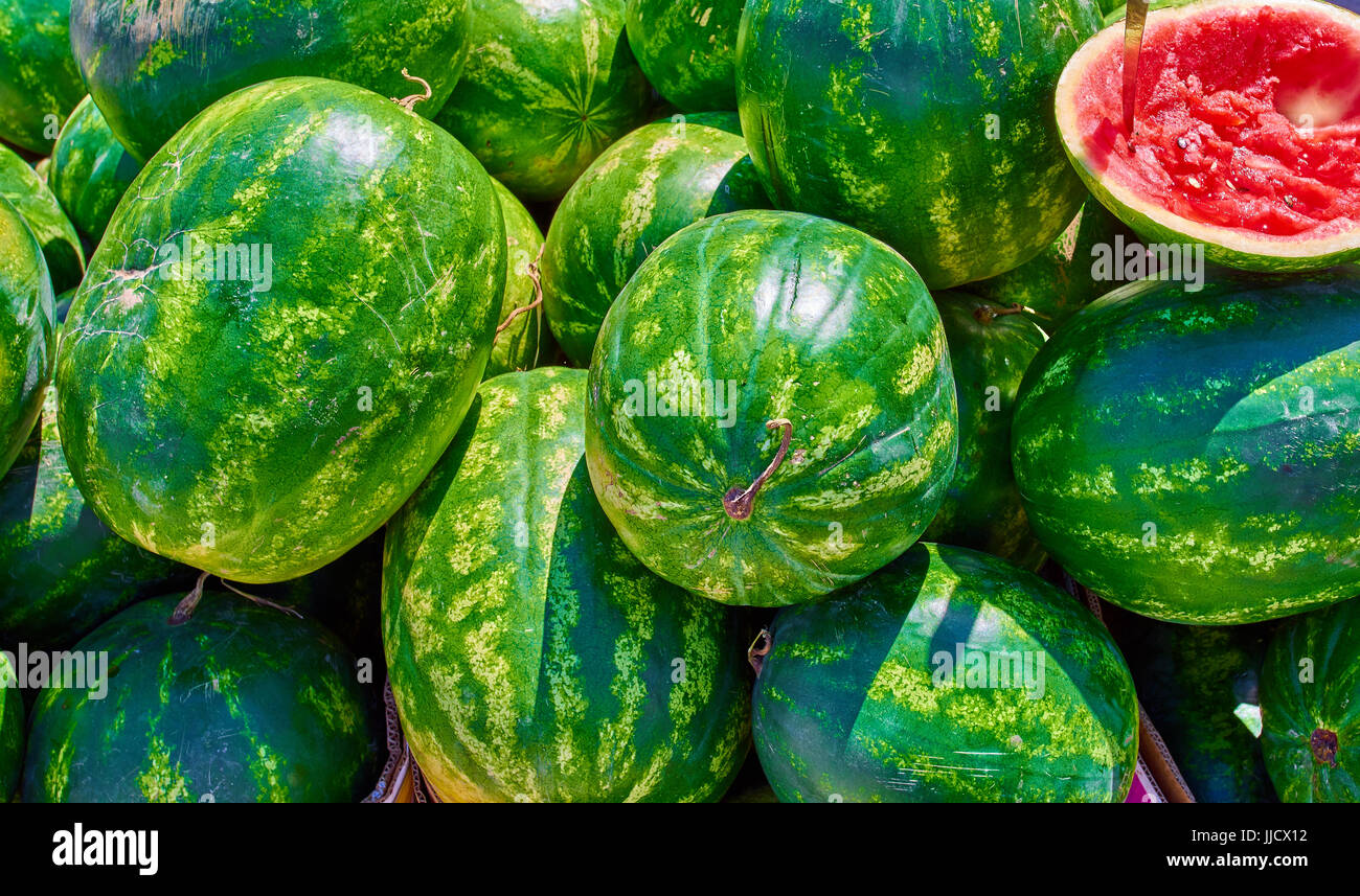 Big sweet green organic ripe watermelons. stacking watermelons ...